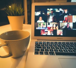 macbook air displaying woman in white shirt